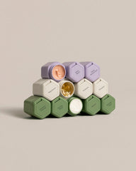 Cadence magnetic travel containers in Eucalyptus, Sand, and Lavender colors - main-only